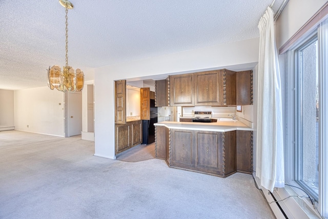 kitchen with light carpet, electric stove, open floor plan, light countertops, and a sink