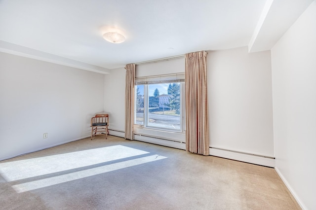 unfurnished room featuring baseboard heating, carpet flooring, and baseboards