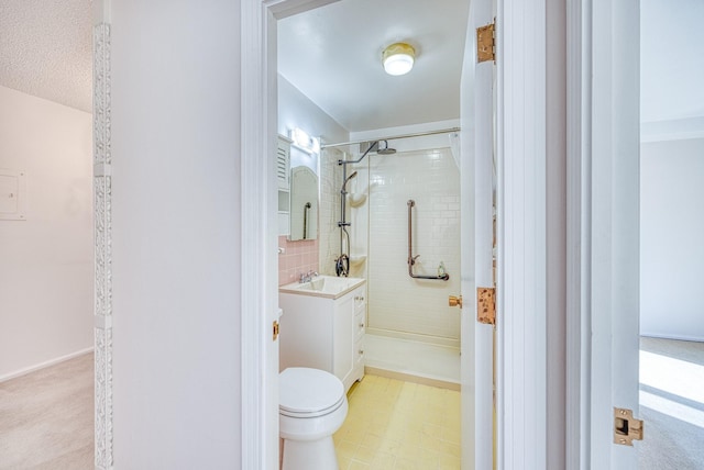 bathroom featuring a stall shower, vanity, toilet, and tile patterned floors