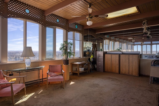 sitting room featuring wooden ceiling, carpet, ceiling fan, and beam ceiling