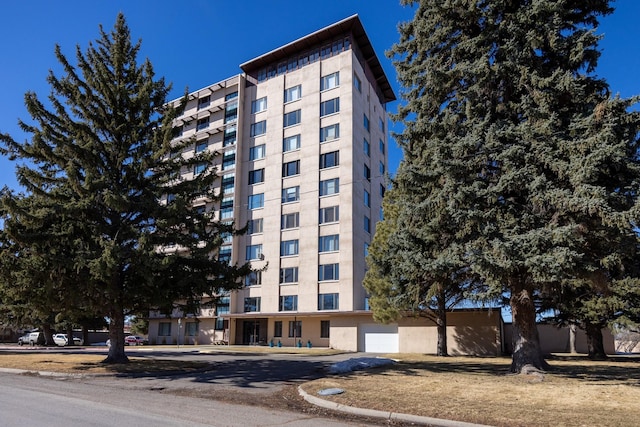 1536 Meadowlark Dr Unit 2B, Great Falls, MT 59404 - view of property hidden behind natural elements with stucco siding and aphalt driveway