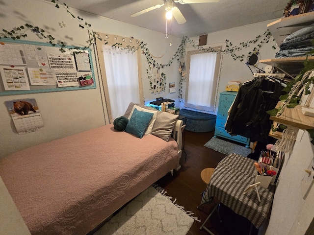 bedroom with ceiling fan and wood finished floors