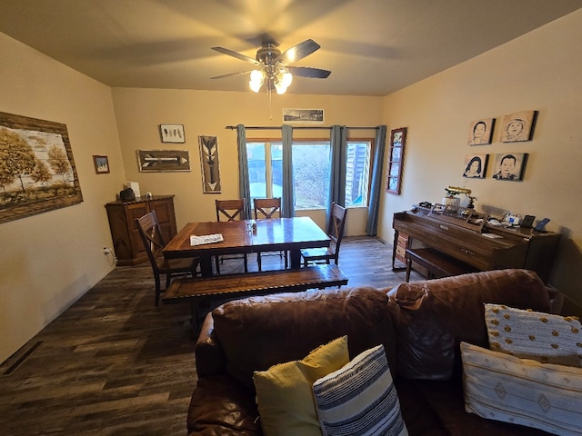 dining space featuring a ceiling fan and dark wood-style flooring