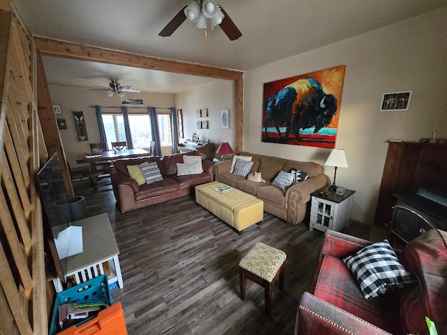 living room featuring a ceiling fan and wood finished floors