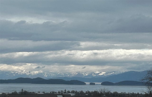 view of mountain feature featuring a water view