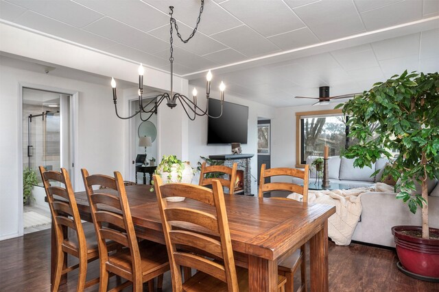 dining space featuring dark wood finished floors and ceiling fan