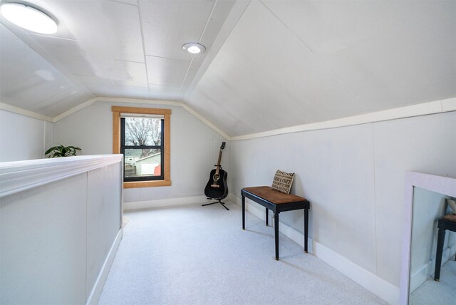 bonus room with carpet floors, lofted ceiling, and baseboards