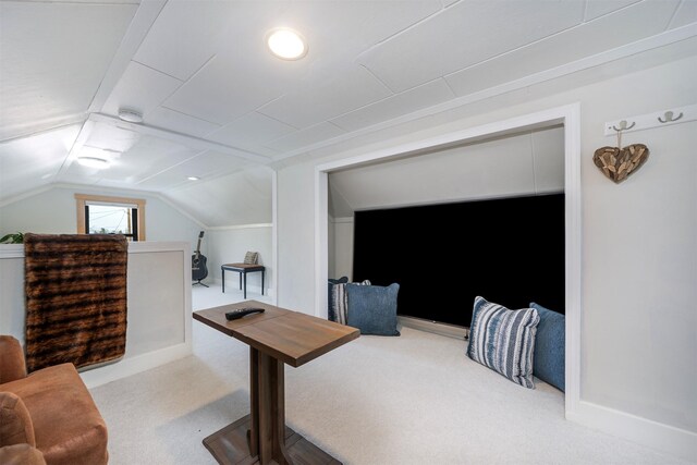 carpeted office space featuring lofted ceiling