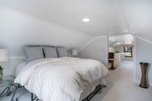 bedroom with vaulted ceiling, recessed lighting, and light colored carpet