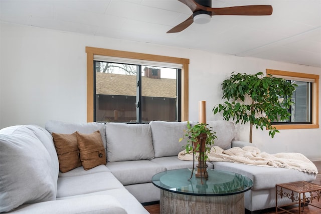 living area featuring a ceiling fan