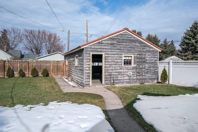 view of outbuilding featuring a fenced backyard and an outdoor structure