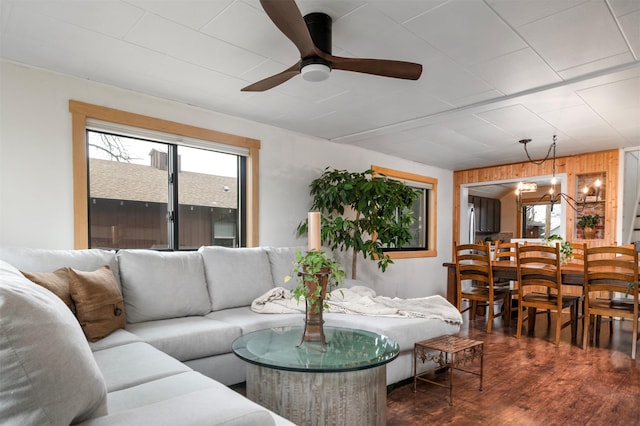 living area with a ceiling fan and dark wood-style flooring