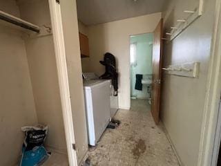 laundry room with washer / dryer and cabinet space