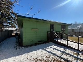 back of house with fence