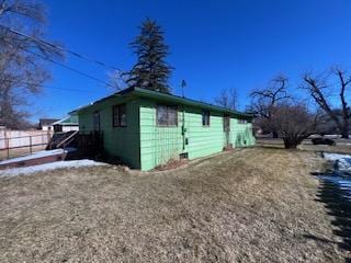 view of property exterior with fence