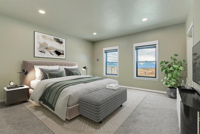 carpeted bedroom featuring recessed lighting and baseboards