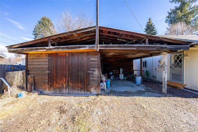 view of vehicle parking with a carport