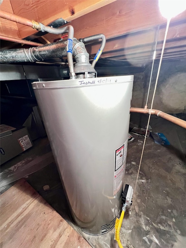 utility room featuring gas water heater