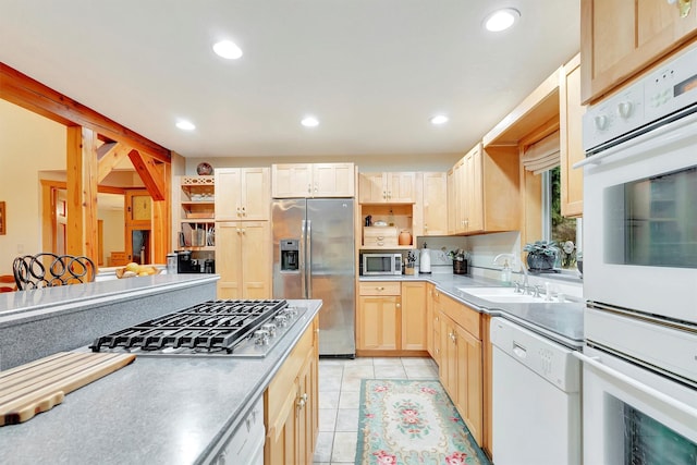 kitchen with light tile patterned floors, stainless steel appliances, open shelves, a sink, and recessed lighting