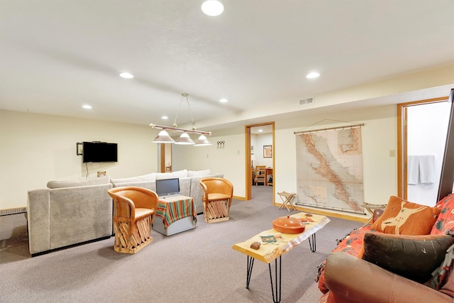 living area featuring carpet floors, visible vents, and recessed lighting