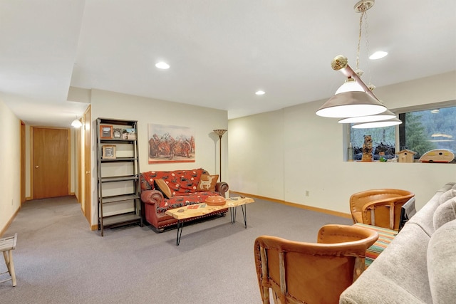 carpeted living room featuring baseboards and recessed lighting