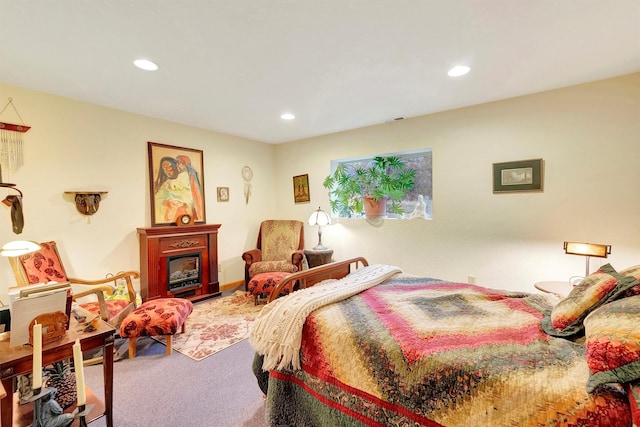 bedroom featuring carpet floors, recessed lighting, visible vents, and a fireplace