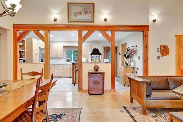 dining space with light wood-type flooring and recessed lighting