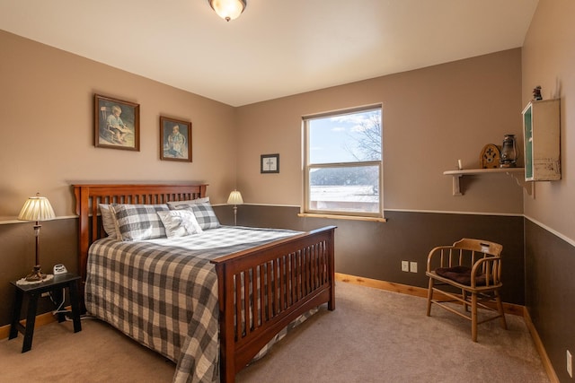 bedroom featuring carpet flooring and baseboards