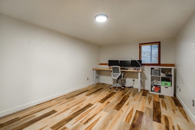 office area featuring wood finished floors and baseboards