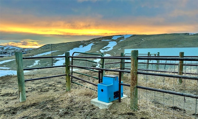 view of stable featuring a mountain view