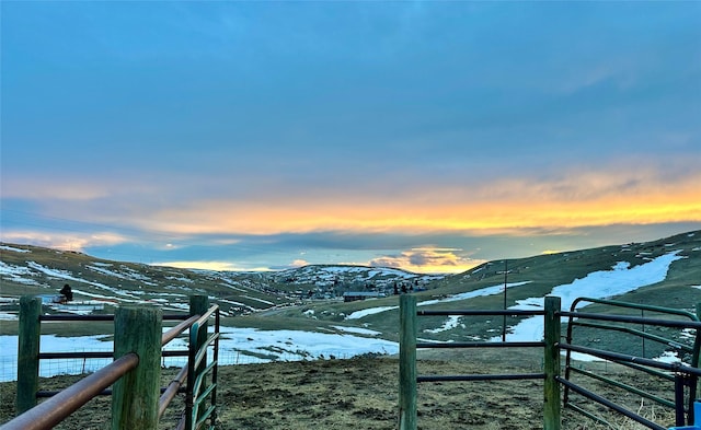 exterior space featuring a mountain view and fence