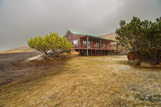 view of yard featuring a wooden deck