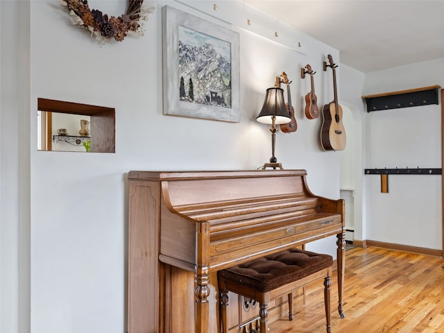 living area featuring wood finished floors and baseboards