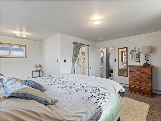 bedroom with a baseboard radiator and carpet flooring