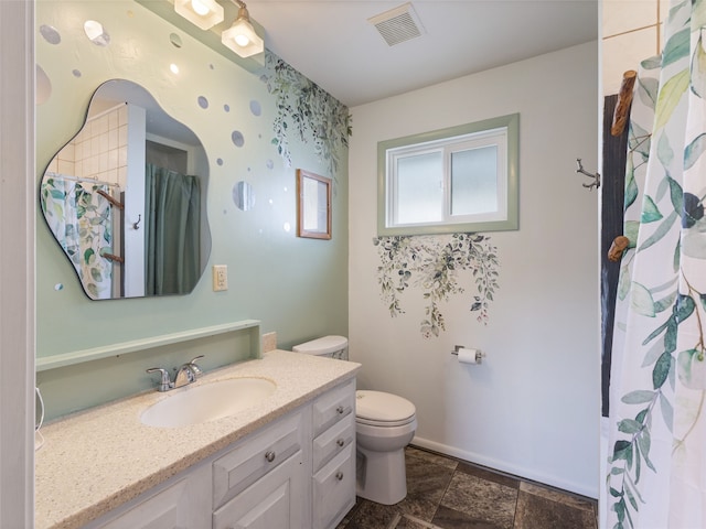 full bathroom with toilet, vanity, visible vents, baseboards, and stone finish floor