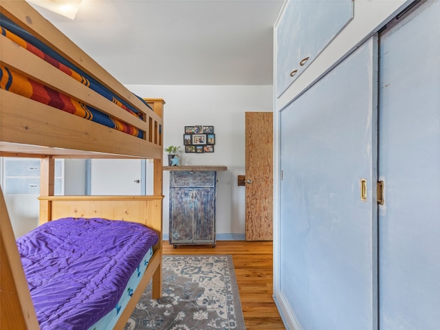 bedroom featuring wood finished floors