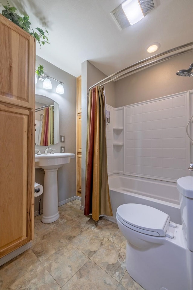 bathroom with toilet, shower / bath combo, a sink, and visible vents