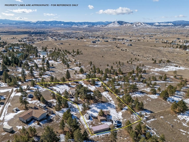 drone / aerial view featuring a mountain view