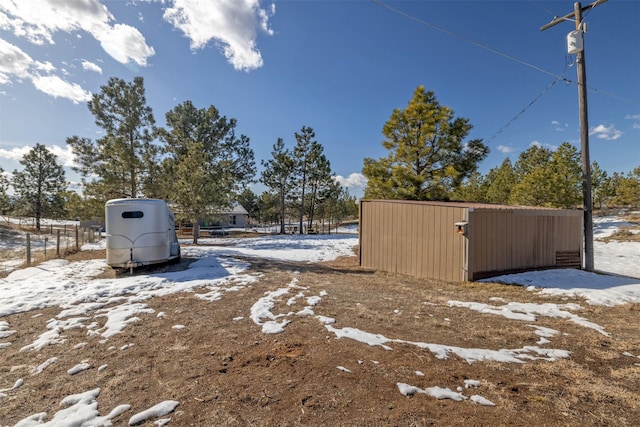 view of yard covered in snow