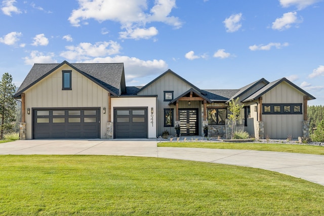 modern farmhouse with driveway, roof with shingles, an attached garage, a front lawn, and board and batten siding