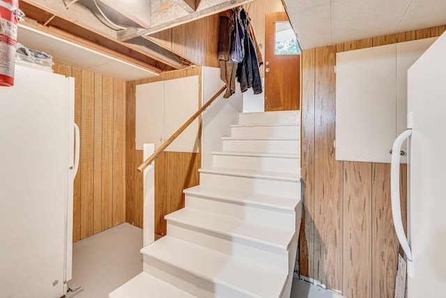 stairway with wooden walls