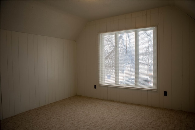 bonus room featuring carpet floors and lofted ceiling