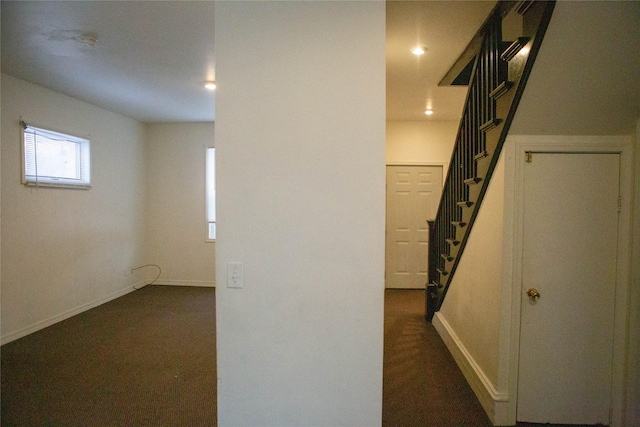 hall featuring recessed lighting, baseboards, and stairs