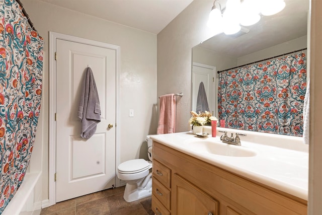 bathroom with toilet and vanity