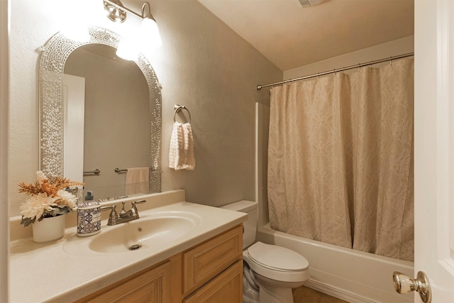 full bathroom with vanity, toilet, and shower / bath combo with shower curtain