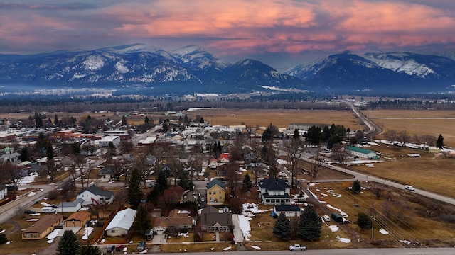 aerial view at dusk with a residential view and a mountain view