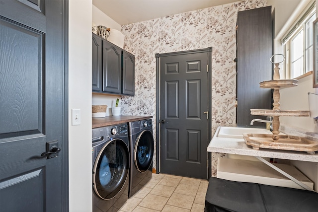 5331 Fiddler Ct, Florence, MT 59833 - laundry area with cabinet space, wallpapered walls, washer and clothes dryer, and light tile patterned floors