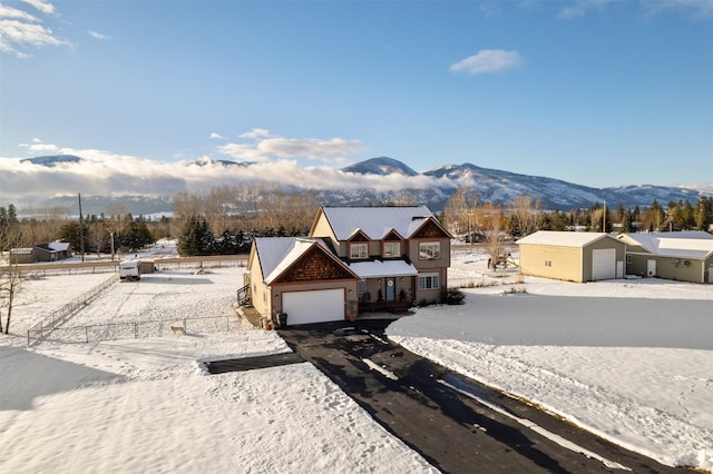 view of front facade with a garage and a mountain view