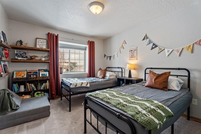 bedroom featuring light carpet and a textured ceiling