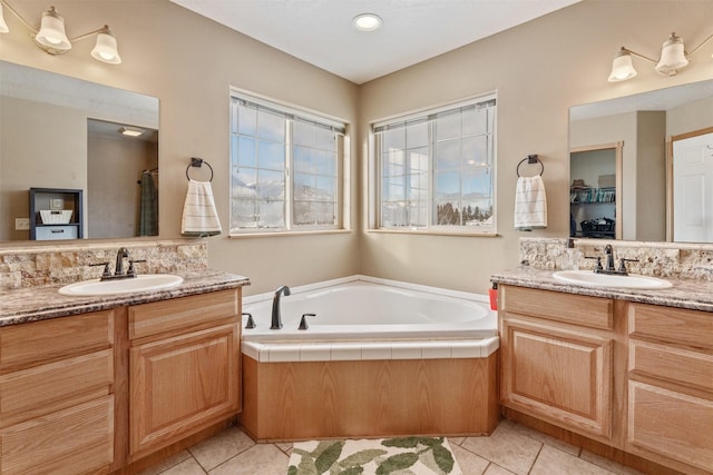 5331 Fiddler Ct, Florence, MT 59833 - full bathroom with tile patterned flooring, two vanities, and a garden tub